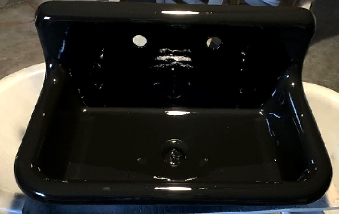 Refinished cast iron sink in glossy black by Blackstone Tub Refinishers Calgary